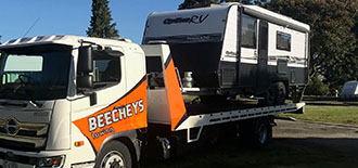 Photo of caravan on the back of a Beecheys Towing tow truck